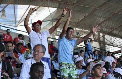 Spectators cheer on athletes at Dubai Police Stadium. Pawan Singh / The National