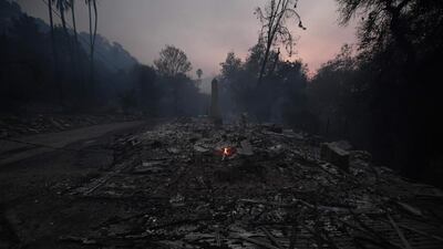 Flames from the Thomas wildfire destroy a home in Carpinteria, California. Mark Ralston / AFP