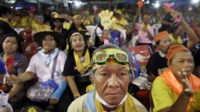 Thai demonstrators listen to speeches condemning the Bangkok Police on Oct 9 2008, as they illegally occupy Government House.