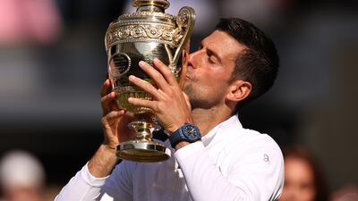 Novak Djokovic kisses the trophy following his victory against Nick Kyrgios in the Wimbledon final, on Sunday, July 10, 2022. Getty