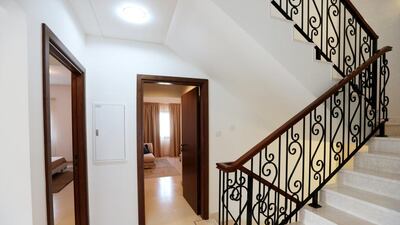 A sweeping staircase in the centre of the property. Christopher Pike / The National