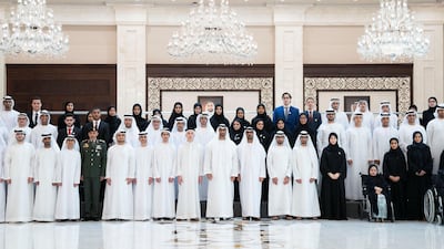 Sheikh Mohamed bin Zayed stands for a photograph with outstanding pupils and their parents at Al Bateen Palace. Seen with Maj Gen Pilot Sheikh Ahmed bin Tahnoon, Chairman of the National and Reserve Service Authority (front row 4th L) and Hussain Al Hammadi, Minister of Education (front row 10th L). Mohamed Al Hammadi / Ministry of Presidential Affairs