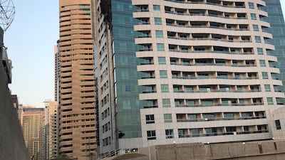 Forensic teams were on site for much of Sunday, as residents whose apartments were unaffected by fire and smoke were allowed back into their homes. Nicholas Webster / The National