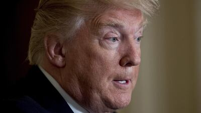 President Donald Trump pauses during a news conference in the East Room at the White House in Washington. Andrew Harnik / AP