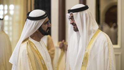 Sheikh Mohammed bin Rashid, Vice President and Ruler of Dubai, speaks with Sheikh Mohammed bin Zayed, Crown Prince of Abu Dhabi and Deputy Supreme Commander of the Armed Forces, during an Eid Al Adha reception at Mushrif Palace. Ryan Carter / Crown Prince Court – Abu Dhabi