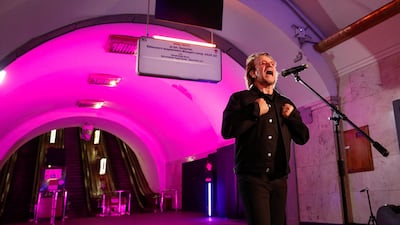 Bono sings during a performance for Ukrainian people inside a subway station in Kyiv. Reuters