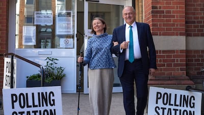Leader of the Liberal Democrats Ed Davey and his wife Emily Gasson leave the polling station in Surbiton. Getty Images