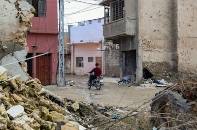 An Iraqi man rides his motorcycle through the ancient, war-torn city of Mosul, on February 21, 2020. Zaid Al Obeidi / AFP