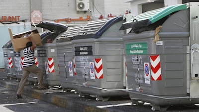 Abu Dhabi is changing its waste collection policy to encourage residents to recycle. The new bins are black for non-recyclables and green bins for recyclables. Ravindranath K / The National