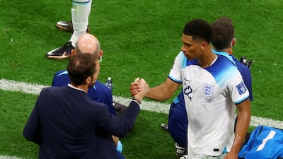 England's Jude Bellingham shakes hands with manager Gareth Southgate after being substituted. Reuters