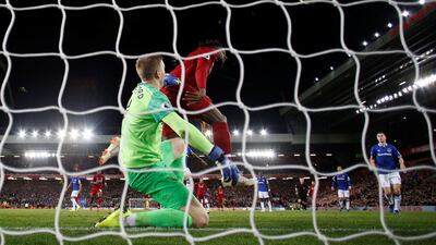 Divock Origi scores the only goal of the game as Liverpool beat Everton at Anfield on Sunday. Reuters