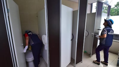 Members of Seoul’s ‘hidden camera-hunting’ squad inspecting a women’s bathroom stall to find secret cameras. South Korea takes pride in its tech prowess, from ultra-fast broadband to Samsung’s cutting-edge smartphones. But it’s a culture that has also given rise to an army of tech-savvy peeping Toms in a still male-dominated country with a poor record on women’s rights. Jun Yeon-je / AFP