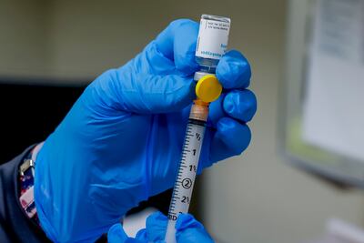 A nurse fills a syringe with a dose of the monkeypox vaccine. EPA.