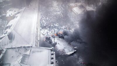 An aerial view shows pro-European protesters burning tyres during clashes with riot police. Reuters