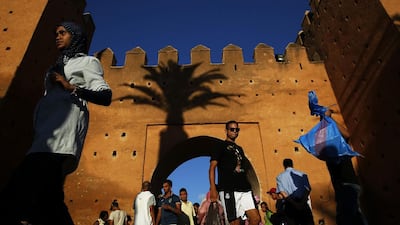 People walk through Bab el Had gates of Rabat’s Medina.
