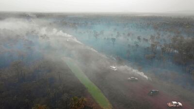 Aerial view of damage caused by wildfires in Otuquis National Park, in the Pantanal ecoregion of southeastern Bolivia, on August 26, 2019. Like his far right rival President Jair Bolsonaro in neigboring Brazil, Bolivia's leftist leader Evo Morales is facing mounting fury from environmental groups over voracious wildfires in his own country. While the Amazon blazes have attracted worldwide attention, the blazes in Bolivia have raged largely unchecked over the past month, devastating more than 9,500 square kilometers (3,600 square miles) of forest and grassland. / AFP / Pablo COZZAGLIO