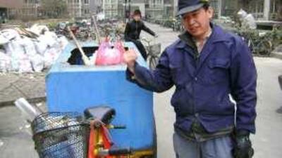 Diao Jun, a rubbish collector, feels his English is good enough to land him a better job.