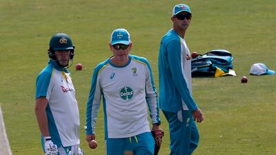 Pat Cummins, left, interim coach Andrew McDonald, centre, and Ashton Agar attend a practice session at the Rawalpindi Cricket Stadium. AP