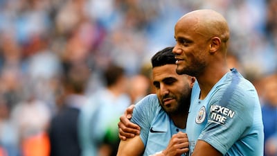 The Belgian Vincent Kompany, right, led Manchester City to an unprecedented domestic treble this season. Neill Hall / EPA