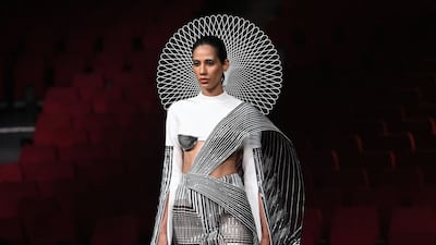 Models present creations by designer Amit Aggarwal during the FDCI India Couture Week in New Delhi on July 30, 2022. All photos: AFP