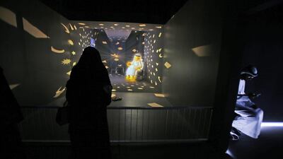 An Emirati woman visits the “Caring Machines” section of the Museum of the future during the opening day of the World Government Summit in Dubai. Kamran Jebreili / AP Photo