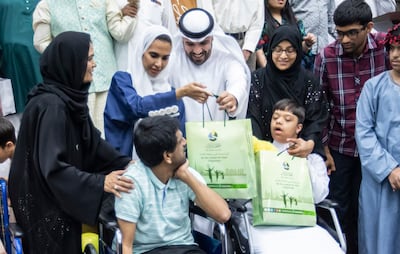 Special guest Khalid Al Ameri with his wife Salama Mohamed at the Dar Al Ber Society iftar. Ruel Pableo / The National