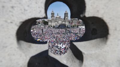 President of Mexico Andres Manuel Lopez Obrador and his wife Beatriz Gutierrez Muller address the public during the presentation of the First Government Report in the Zocalo of Mexico City. EPA