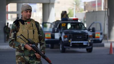 Iraqi security forces stand guard in Najaf. Haidar Hamdani / AFP