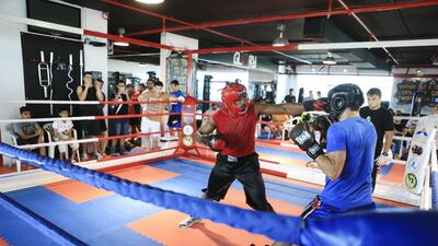 Ousmane Dlor takes on Nadir Ruziev at the Guts & Glory Amateur Tournament at Glory MMA & Fitness Centre in Dubai. Sarah Dea / The National