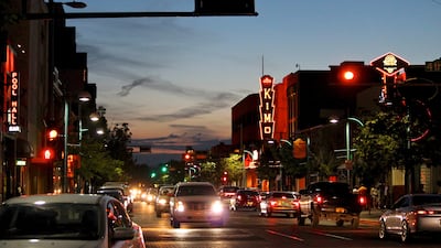 FILE - In this June 21, 2016, file photo, cars make their way along historic Route 66 in downtown Albuquerque, N.M. Albuquerque is one of the cities wooing Amazon to build their second headquarters in their area. (AP Photo/Susan Montoya Bryan, File)