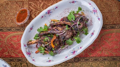 Qartuli's lamb chops are fresh off the grill and seasoned with onions and Georgian tomato satsebeli sauce. Photo: Qartuli