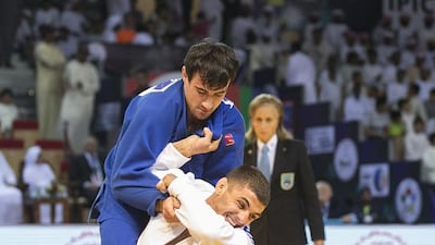 Ivaylo Ivanov and Sergiu Toma, in blue, fight it out in the 81Kg final. Mona Al Marzooqi/ The National