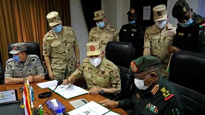 Egyptian military Chief of Staff Mohamed Farid and his Sudanese counterpart Mohamed Othman al-Hussein sign a bilateral agreement during a meeting of the Egyptian-Sudanese military committee in Sudan's capital Khartoum. AFP