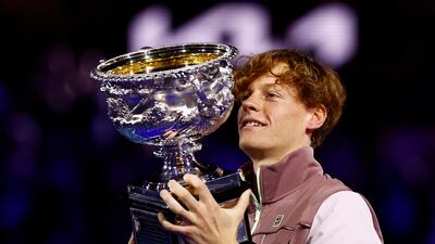 Italy's Jannik Sinner celebrates with the trophy after winning the Australian Open final against Russia's Daniil Medvedev in Melbourne on January 28, 2024 Reuters