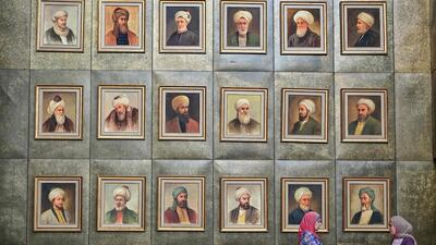 A view of a wall showing the portraits of medieval scholars hanging inside the main building of the Bibliotheca Alexandrina library in Egypt's northern coastal city of Alexandria. AFP