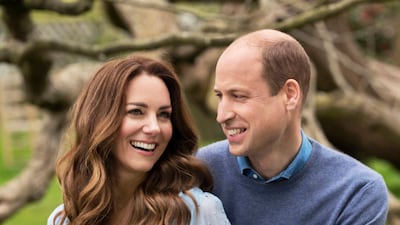 The two new images, taken at Kensington Palace this week by photographer Chris Floyd, capture William and Kate smiling and in a relaxed mood. AP Photo