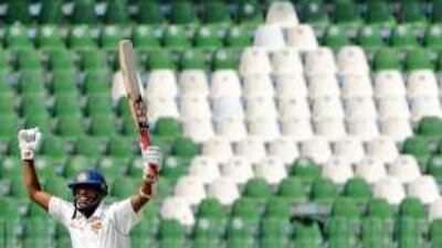 The Sri Lankan cricketer Thilan Samaraweera celebrates after scoring a double century at the Qadafi Cricket Stadium in Lahore on Monday.