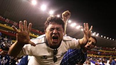 Honduran fans celebrate as their team win the game against El Salvador.