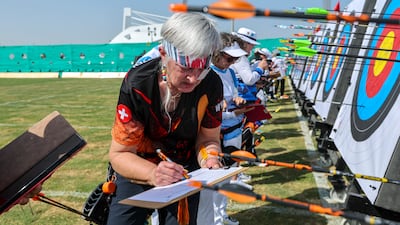 Lisa Wirsing competes in the Recurve 40+ women’s division at the Open Masters Games at the Zayed Cricket Stadium archery grounds. Victor Besa / The National