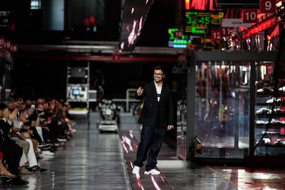 Designer Rocco Iannone walks the runway after the fashion show. AP