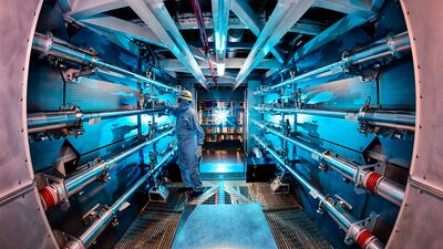 A technician reviews an optic inside the preamplifier support structure at the Lawrence Livermore National Laboratory in Livermore, California. AP