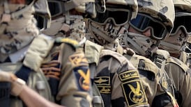 Egyptian army special forces soldiers deploy before the concrete barrier marking the border between Egypt and the Gaza Strip in Rafah in the east of North Sinai province on October 20, 2023 during a visit there by the United Nations secretary-general to oversee preparations for the delivery of humanitarian aid to the war-torn Palestinian enclave. (Photo by Kerolos SALAH / AFP)