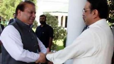 Asif Ali Zardari, right, greets his former coalition partner Nawaz Sharif in Islamabad yesterday.