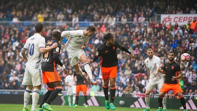 Cristiano Ronaldo of Real Madrid scores the opening goal against Valencia. Denis Doyle / Getty Images