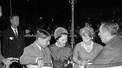 In this Sept. 25, 1960, photo, Crown Prince Akihito and Princess Michiko of Japan take the Mad Hatter's teacup' ride with Walt'Disney and his wife Lillian Disney at Disneyland in Los Angeles. The Japanese royals were in Los Angeles as part of their state visit. AP
