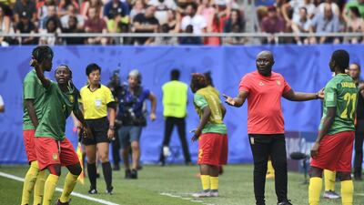 Cameroon's forward Ajara Nchout (2ndL) and Cameroon's coach Alain Djeumfa (2ndR) react after her goal was disallowed for offside during the France 2019 Women's World Cup round of sixteen football match between England and Cameroon at the Hainaut stadium in Valenciennes, northern France. AFP