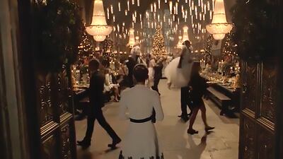 Emma Watson arrives at Hogwarts and steps into a Yule Ball-like party in the Great Hall.
