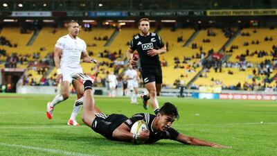 New Zealand's Reiko Ioane, 17, dives for a try against England in the final of Wellington Sevens on Saturday. Anthony Au-Yeung / Getty Images / February 7, 2015