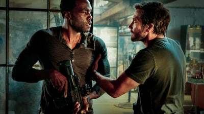 Yahya Abdul-Mateen II, left, and Jake Gyllenhaal play step brothers on the run in Michael Bay's 'Ambulance'. Photo: Andrew Cooper / Universal Pictures