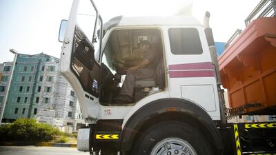 Experts say drivers working in the logistics and transport sector continue to face long hours and poor working conditions that can affect their concentration. Lee Hoagland / The National